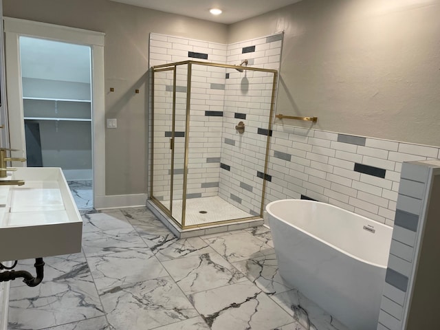 bathroom with vanity and separate shower and tub