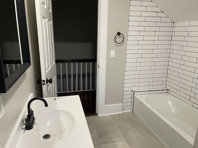 bathroom featuring tile patterned flooring and sink