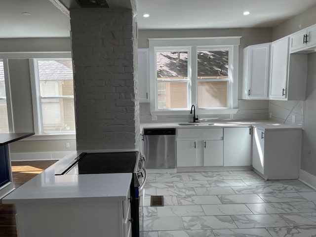 kitchen featuring range, white cabinetry, dishwasher, and sink