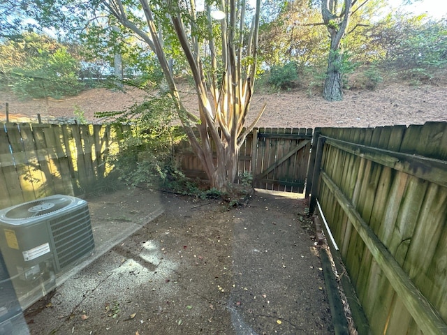 view of yard with central air condition unit