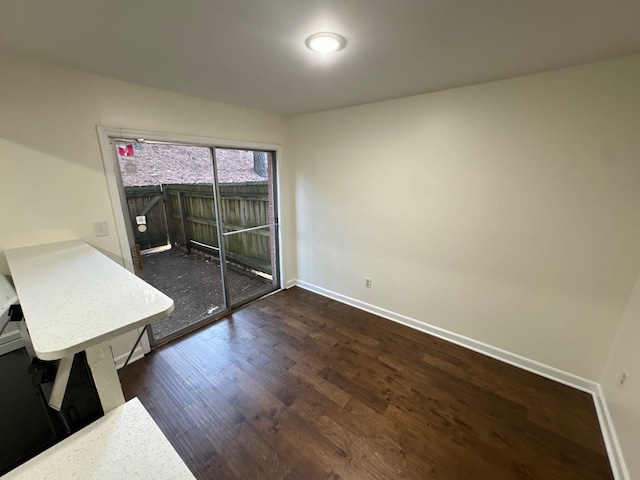 empty room featuring dark wood-type flooring