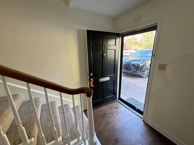 entrance foyer featuring dark hardwood / wood-style floors