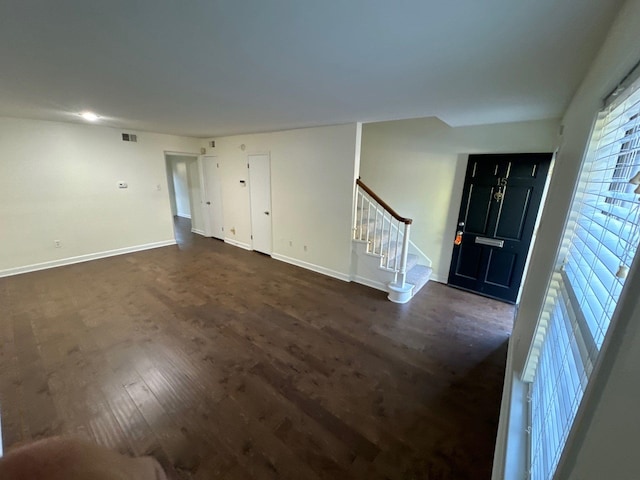 foyer featuring dark wood-type flooring