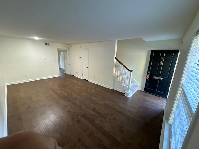 entryway with dark hardwood / wood-style floors