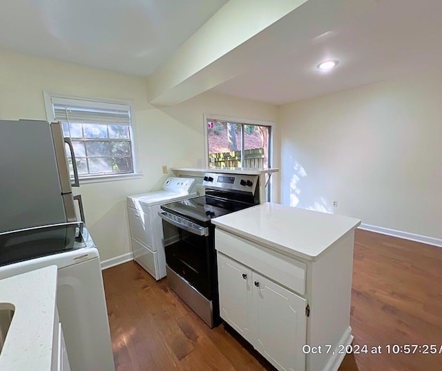 kitchen with dark hardwood / wood-style floors, electric range, white cabinetry, fridge, and separate washer and dryer