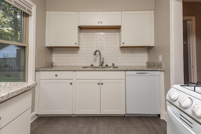 kitchen with white appliances, sink, dark wood-type flooring, and white cabinets