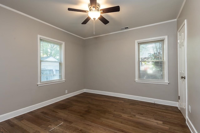 unfurnished room with crown molding, ceiling fan, dark wood-type flooring, and a wealth of natural light