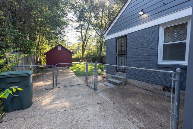 view of patio / terrace featuring a storage shed