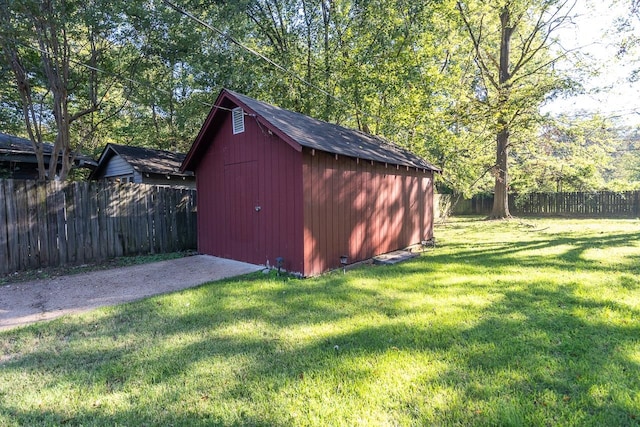 view of outdoor structure featuring a lawn