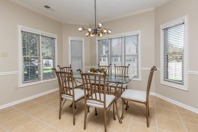 dining space with a chandelier, light tile patterned floors, and ornamental molding