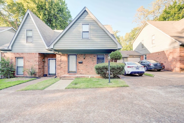 view of front of home with a front yard and a garage