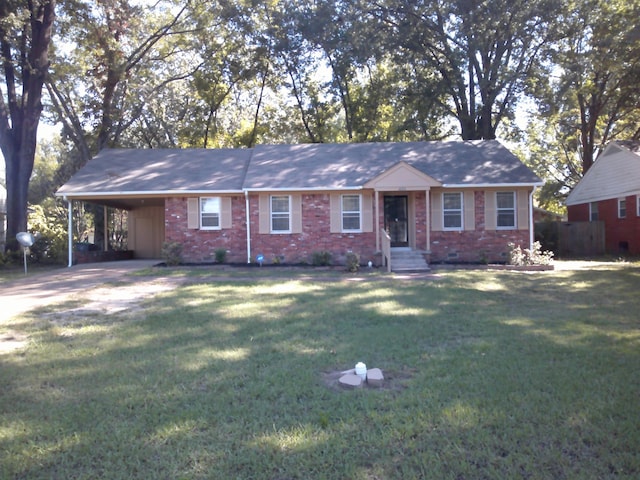 ranch-style house with a front yard and a carport