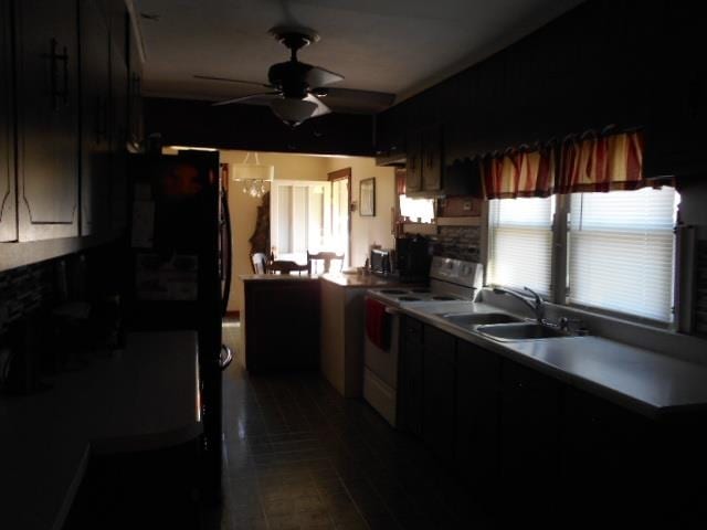 kitchen with tile patterned flooring, white electric range, sink, and ceiling fan