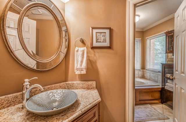 bathroom with vanity and crown molding