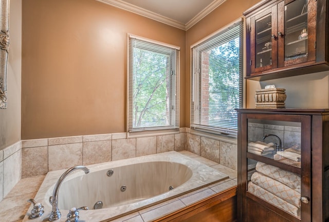 bathroom with tiled bath and crown molding