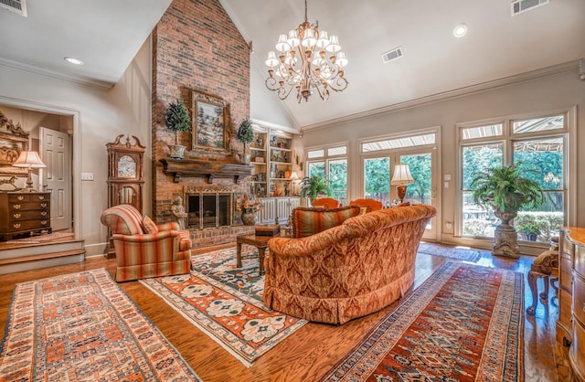 living room with hardwood / wood-style flooring, plenty of natural light, and a fireplace