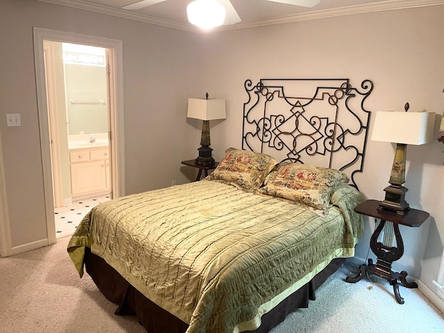 bedroom featuring ornamental molding, light carpet, ceiling fan, and ensuite bathroom