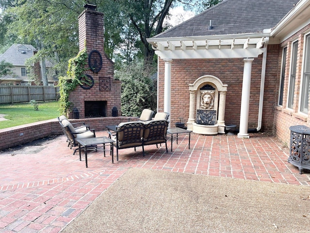 view of patio / terrace featuring an outdoor brick fireplace