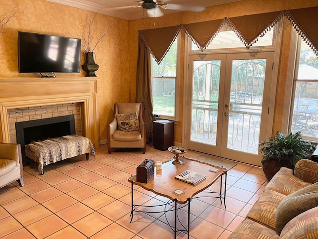 living room with french doors, ceiling fan, light tile patterned floors, and a wealth of natural light