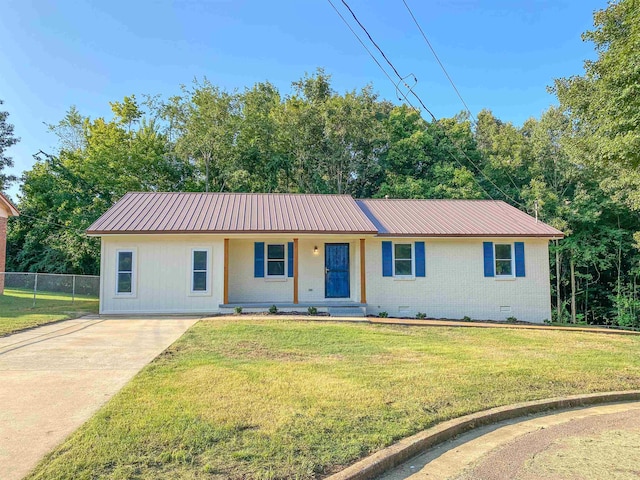 ranch-style home with a front lawn