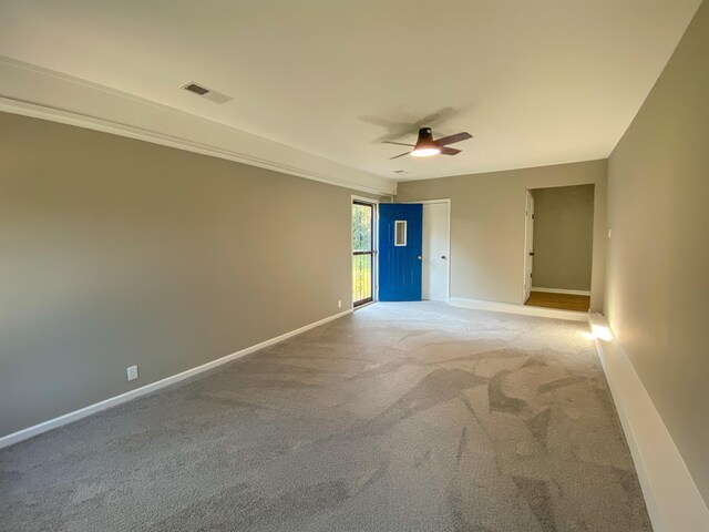 unfurnished room with carpet floors and ceiling fan