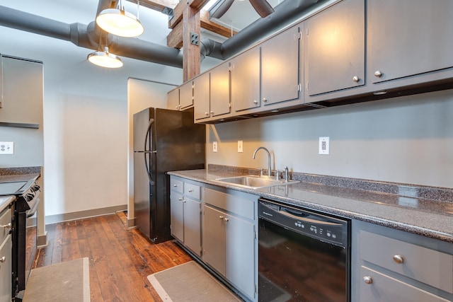 kitchen featuring gray cabinets, dark wood-type flooring, sink, and black appliances