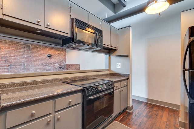 kitchen featuring gray cabinetry, dark wood-type flooring, and black appliances