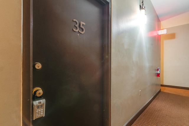 corridor with carpet flooring