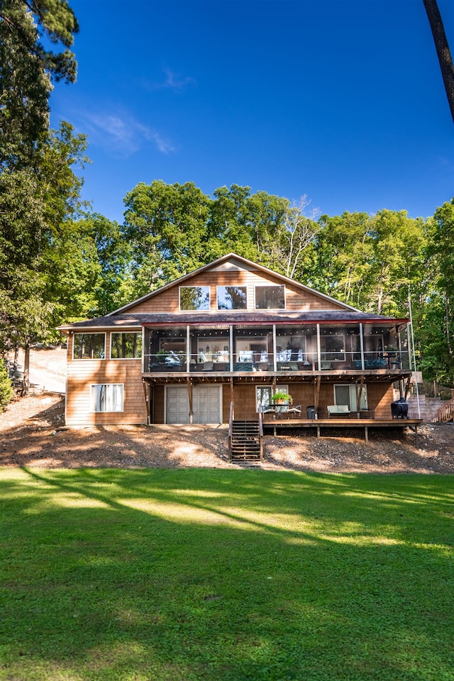 rear view of property with a yard