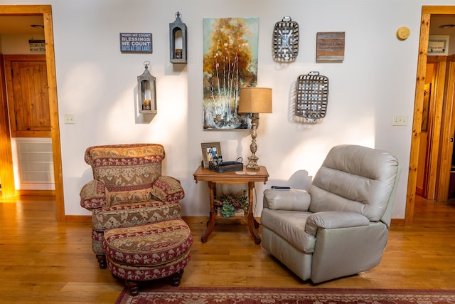 sitting room with hardwood / wood-style floors