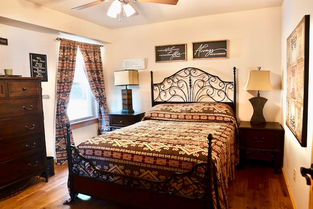 bedroom featuring ceiling fan and hardwood / wood-style floors