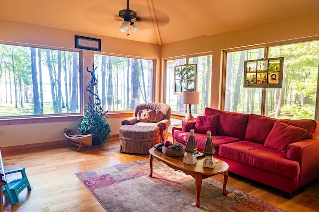 sunroom / solarium with lofted ceiling and ceiling fan