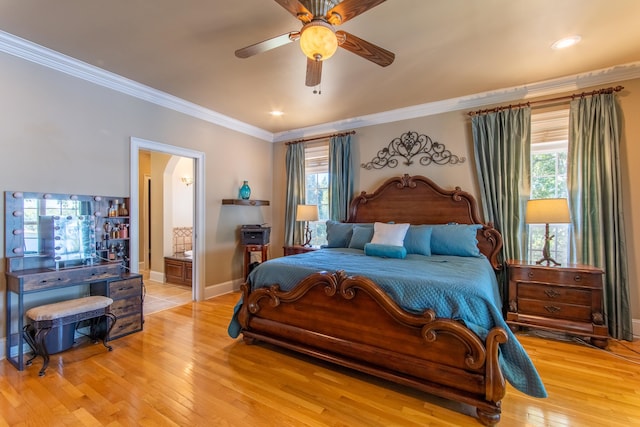 bedroom featuring ensuite bathroom, crown molding, ceiling fan, and light hardwood / wood-style floors