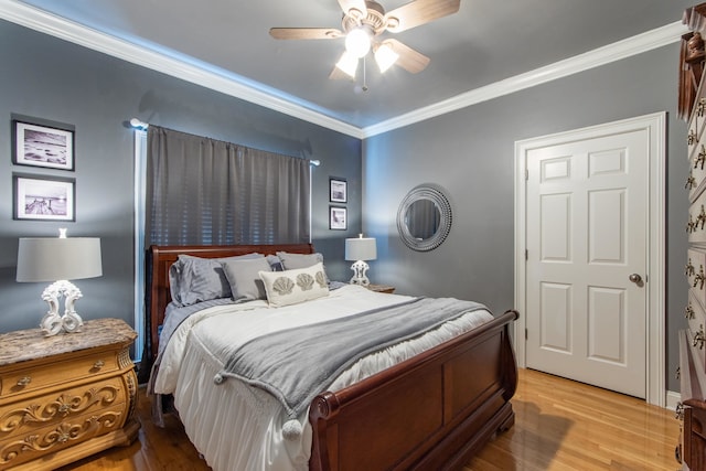 bedroom with ceiling fan, light hardwood / wood-style flooring, and crown molding