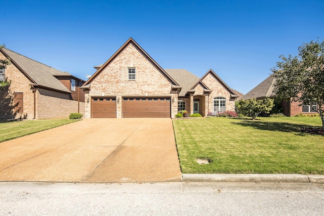 view of front of house featuring a front yard and a garage