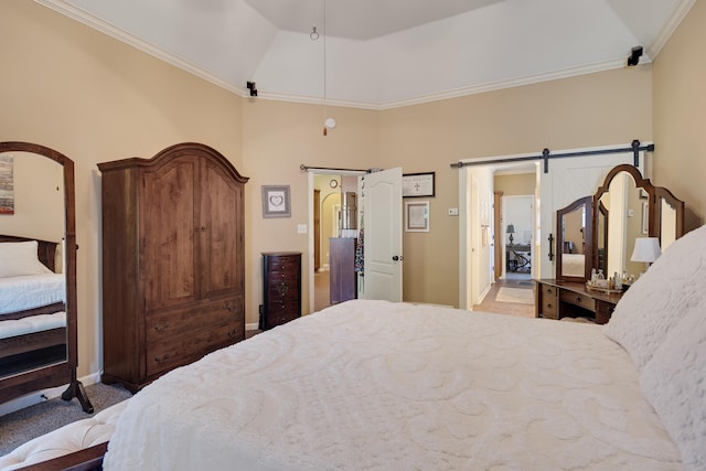 carpeted bedroom featuring ornamental molding, lofted ceiling, and a barn door