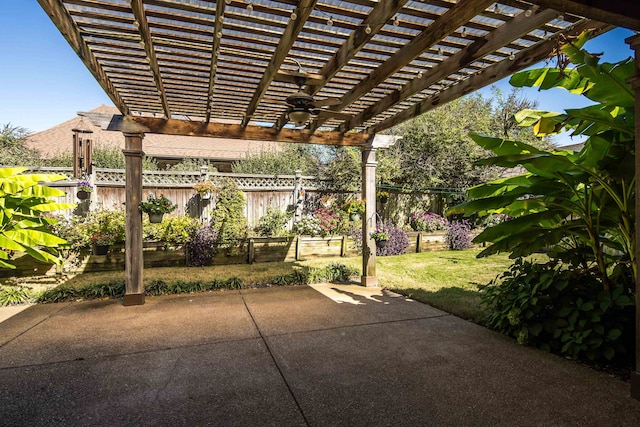 view of patio with ceiling fan and a pergola