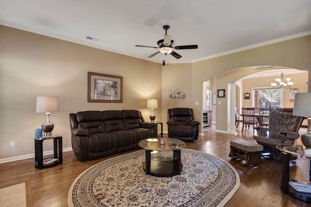 living room with crown molding and dark hardwood / wood-style flooring