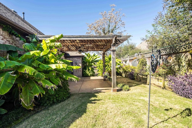 view of yard with a pergola and a patio