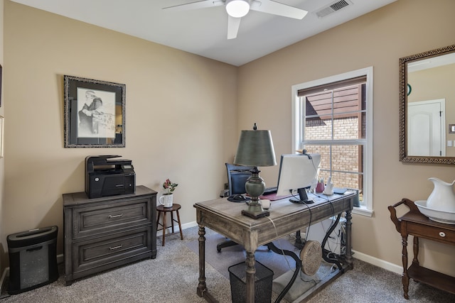 office area with ceiling fan and light carpet