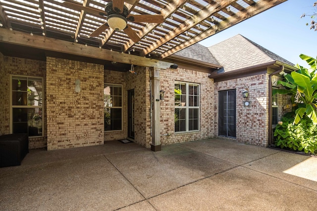 view of patio / terrace with ceiling fan and a pergola