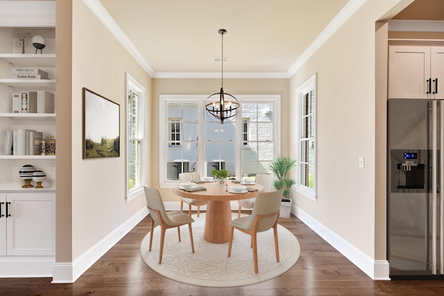 dining space featuring dark hardwood / wood-style floors, a chandelier, and ornamental molding