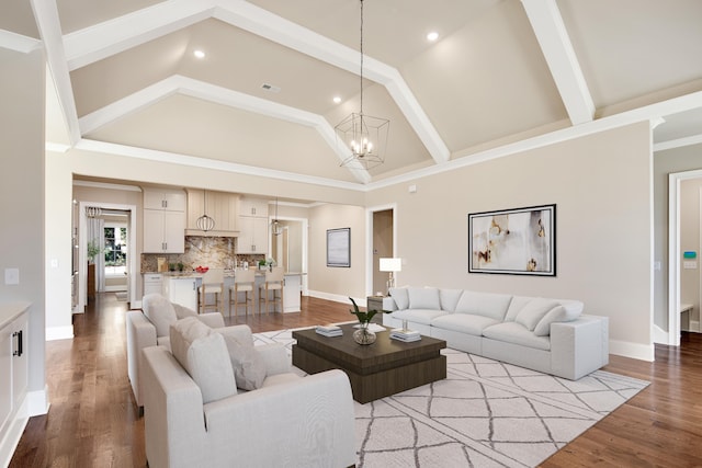 6625 Pidgeon Woods Cv, Memphis, TN 38119 - living area featuring high vaulted ceiling, a chandelier, wood finished floors, baseboards, and beam ceiling