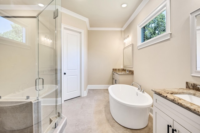 bathroom featuring plus walk in shower, ornamental molding, a wealth of natural light, and vanity