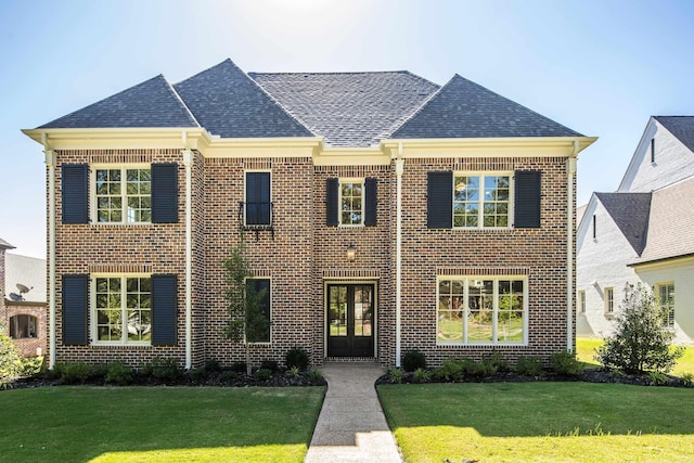 6625 Pidgeon Woods Cv, Memphis, TN 38119 - view of front of house with a front yard, brick siding, and french doors