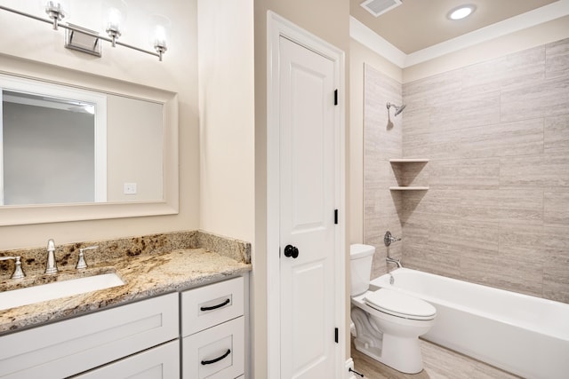 full bathroom featuring hardwood / wood-style floors, vanity, toilet, and tiled shower / bath combo