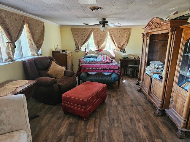 bedroom featuring ceiling fan, dark hardwood / wood-style floors, and ornamental molding