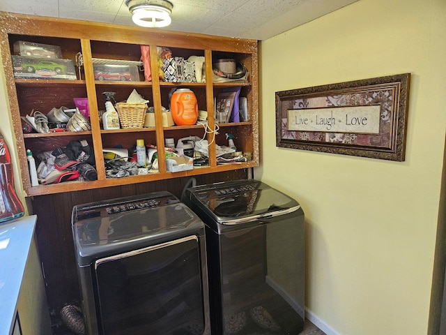 laundry area with independent washer and dryer