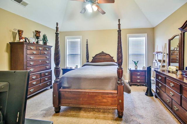 bedroom with lofted ceiling, light carpet, and ceiling fan