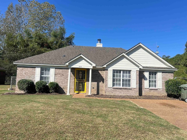 ranch-style home with a front yard